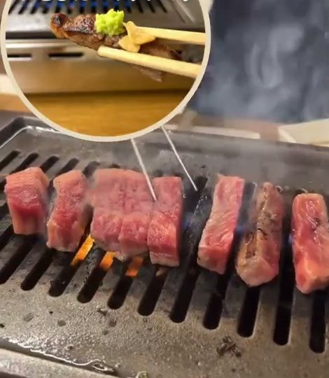 網の上で焼かれる厚切りの淡路和牛